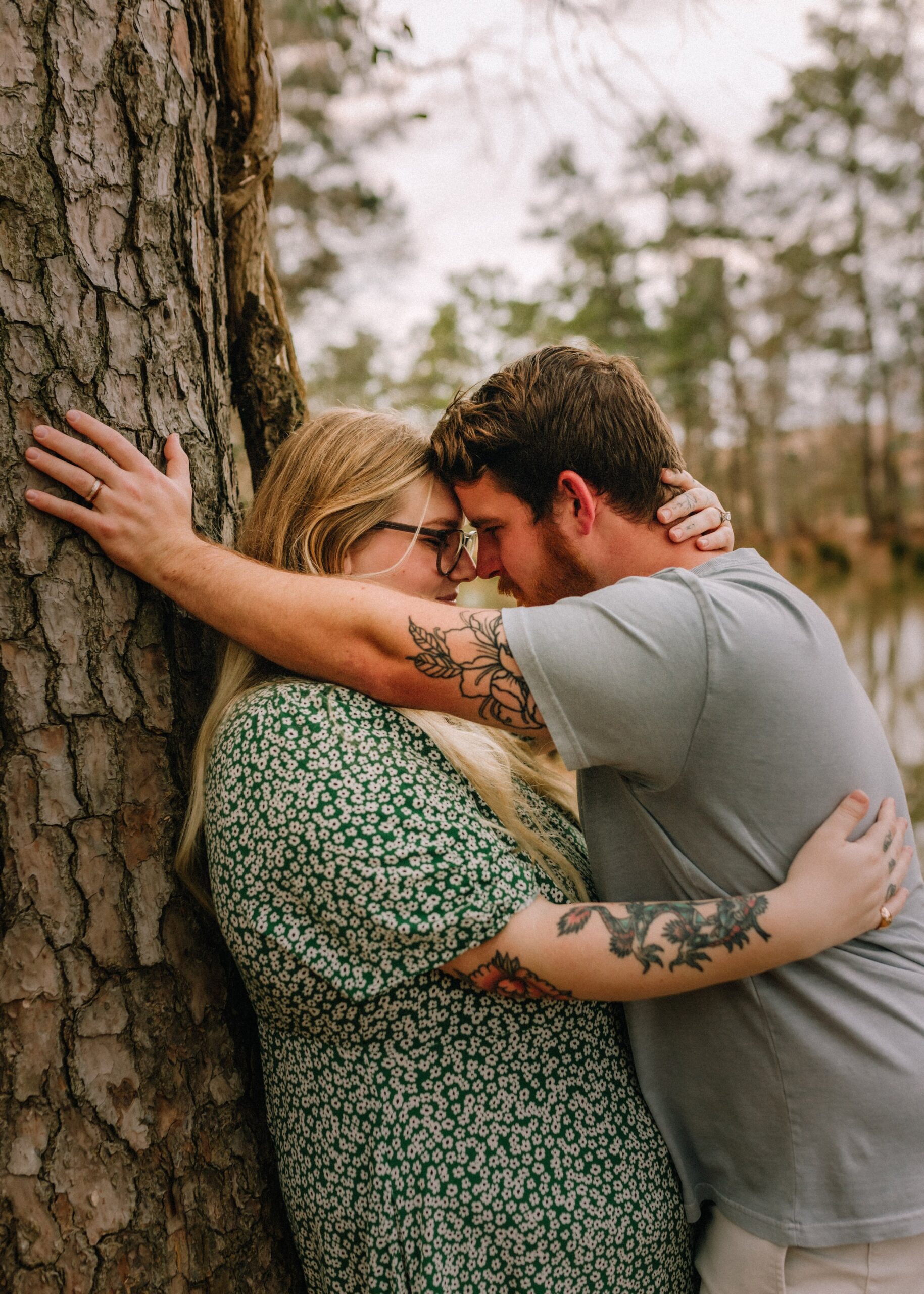 T&M - couple leaning against tree sharing romantic moment - photo by Brittney Stanley Be Seen Photos.jpg